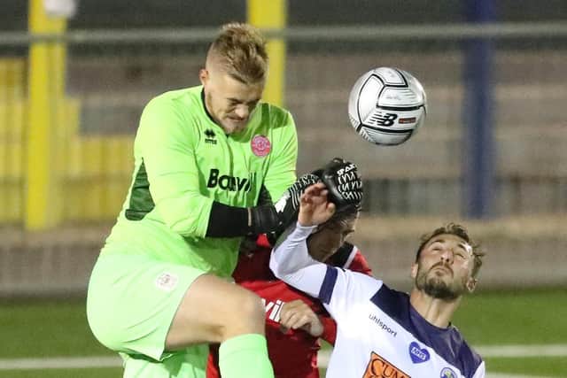 Chatham keeper Jordan Carey fails to collect, leading to Joe Iaciofano putting Hawks into the lead. Pic: Dave Haines.