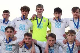 Pompey Academy keeper Toby Steward, centre, celebrates after Henry Cort Community School's Hampshire FA Cup success. Picture: Neil Marshall