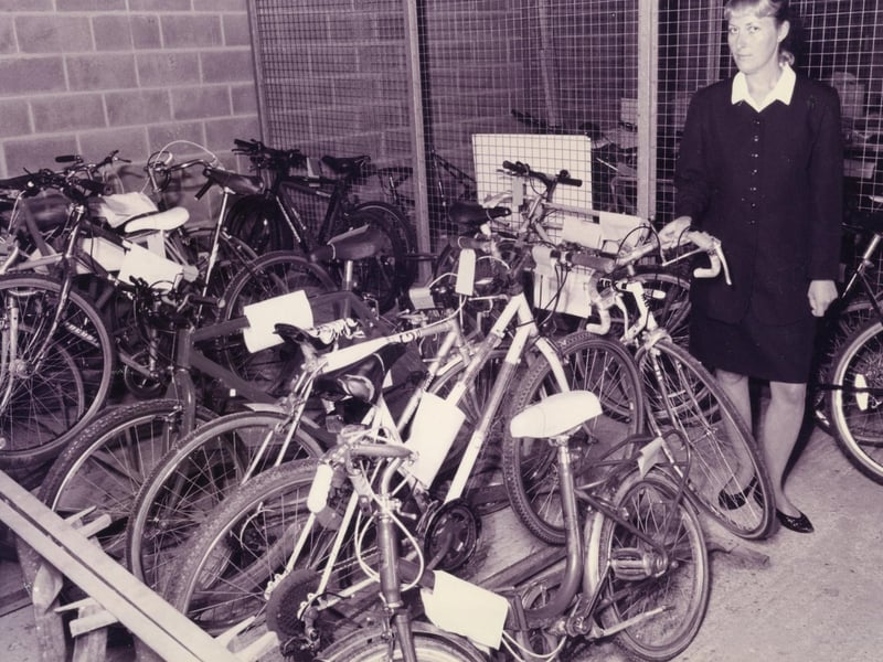 WPC Clare Harley of Fareham police station, with some of the many unclaimed bikes at the station, after a raise in bike crime in the area, October 1995. The News PP5528