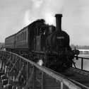 The Hayling Billy in her prime crossing Langstone trestle bridge.