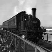 The Hayling Billy in her prime crossing Langstone trestle bridge.