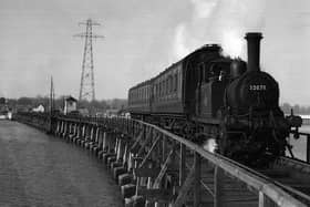 The Hayling Billy in her prime crossing Langstone trestle bridge.