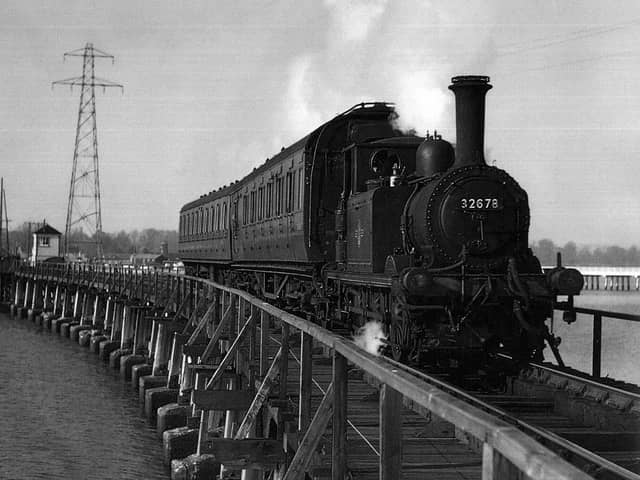 The Hayling Billy in her prime crossing Langstone trestle bridge.