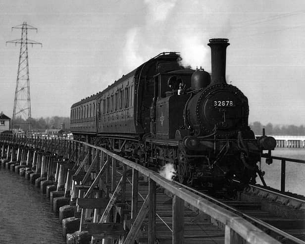 The Hayling Billy in her prime crossing Langstone trestle bridge.