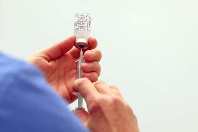 A vial of the Moderna Covid-19 vaccine being prepared. Photo by Steve Parsons / POOL / AFP via Getty Images
