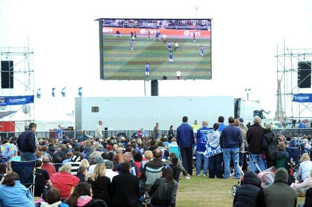 Pompey fans watch the 2010 FA Cup final on a big screen in the family section on Southsea Common Picture: Paul Jacobs (101534-13)