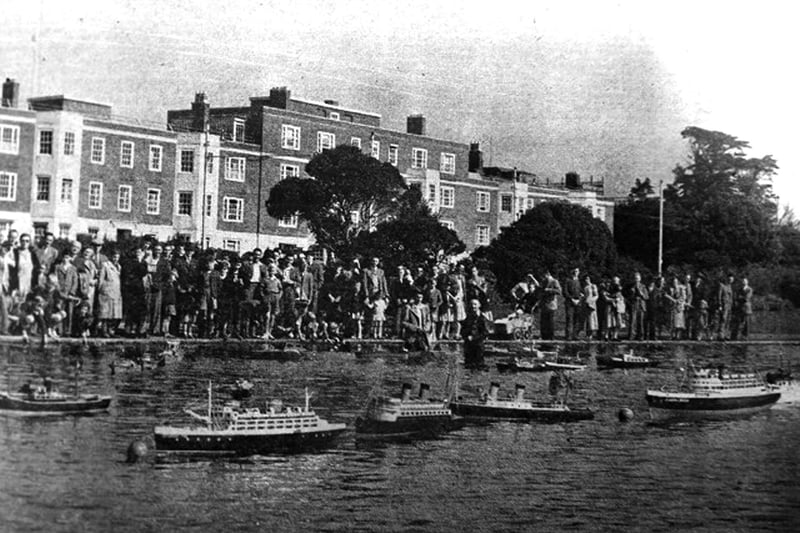 Model ships of all kinds watched by a vast audience at Canoe Lake, Southsea.