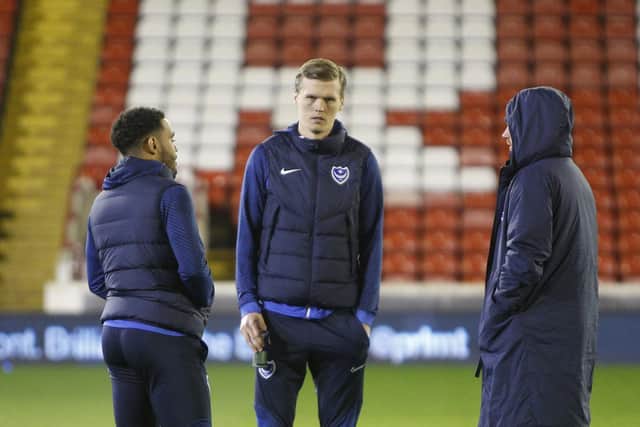 Sean Raggett believes Pompey will look to go under the radar in a bid to reach the play-offs.