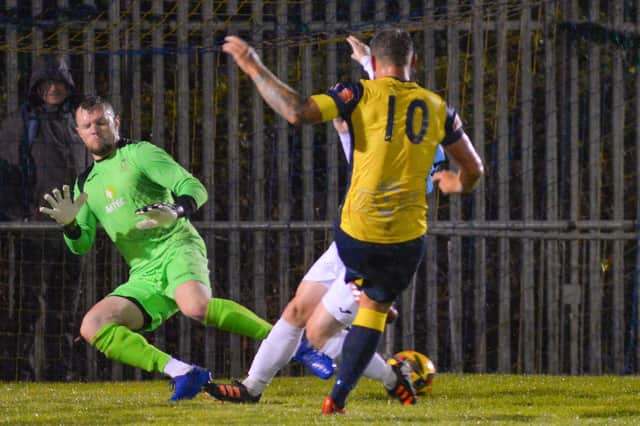 Moneyfields striker Steve Hutchings sees a shot deflected wide in last night's Wessex Premier derby win against US Portsmouth. Picture: Martyn White.