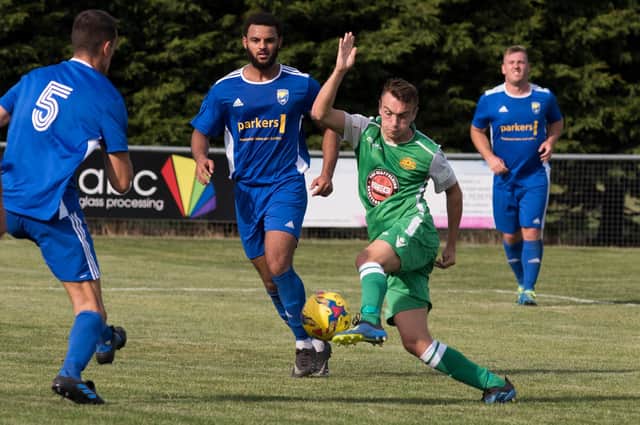 Ryan Pennery (green) in action for Moneyfields in the 2019/20 season. Picture: Duncan Shepherd