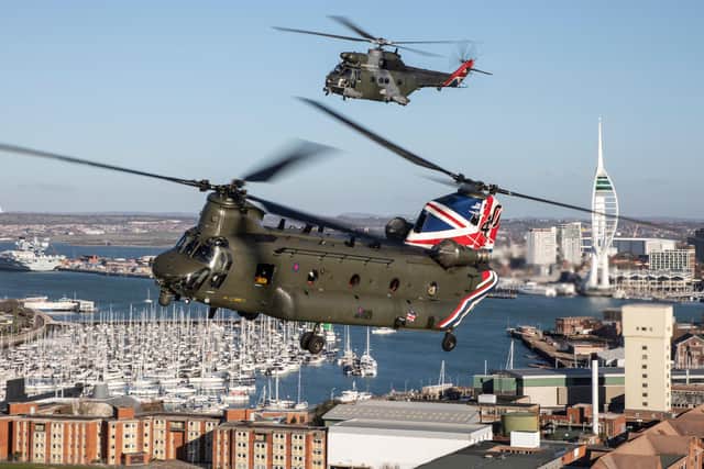 A formation flight of specially painted Chinook and Puma helicopter flying over Portsmouth to mark 90 years of combined service in the RAF. 
Image by Cpl Tim Laurence RAF.
