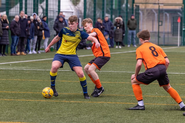 Action from the 2-2 draw between the under-18s of Moneyfields (blue/yellow kit) and AFC Portchester (orange/black kit). Picture: Mike Cooter