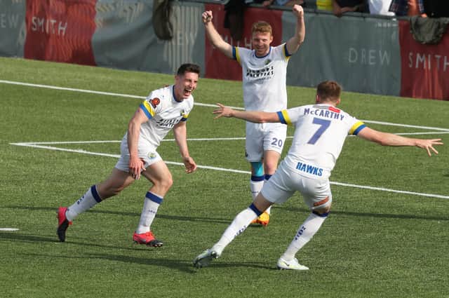 James Roberts celebrates after grabbing his second goal in Hawks' victory over Hampton & Richmond Picture: Dave Haines