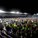 The pitch invasion after Pompey were crowned League One champions. Picture: Sarah Standing.
