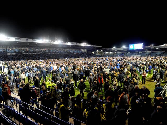 The pitch invasion after Pompey were crowned League One champions. Picture: Sarah Standing.