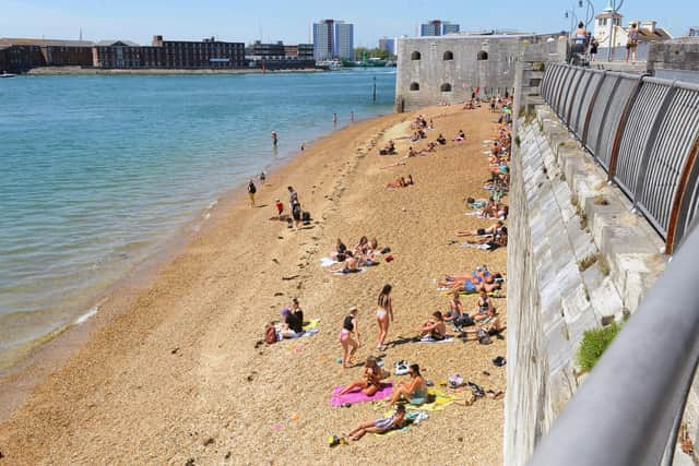 People at the Hot Walls in Old Portsmouth. Picture: Sarah Standing (210520-8798)