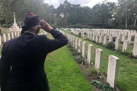 WW2 Veteran Den Hosgood saluting the fallen at a CWG Cemetery