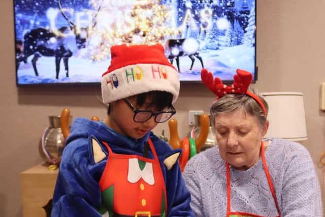 Resident Maggie Snedden, 80, joined by Fleet local Utsav, 9
