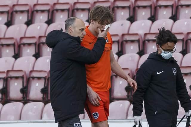 Sean Raggett goes off injured against Wigan Athletic on Monday.  Picture: Daniel Chesterton/phcimages.com