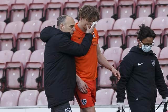 Sean Raggett goes off injured against Wigan Athletic on Monday.  Picture: Daniel Chesterton/phcimages.com