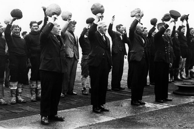 Reserve naval officer leads dockyard workers in three cheers for the visit of King George VI to Portsmouth a week before the first Christmas of war. The News PP506