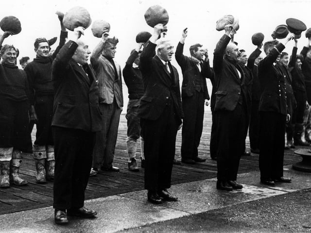 Reserve naval officer leads dockyard workers in three cheers for the visit of King George VI to Portsmouth a week before the first Christmas of war. The News PP506