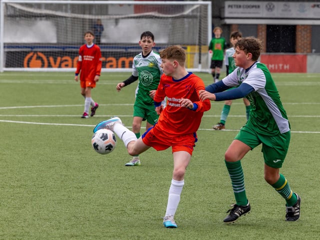 Action from the Under-13 Truman Challenge Cup final between Denmead Youth Lions (orange shirts) and Moneyfields Youth Yellow. Picture: Mike Cooter
