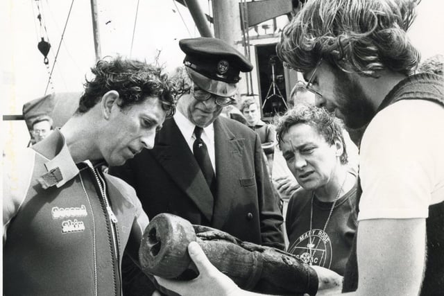 Prince Charles inspecting a metal powder cask, one of the items recovered recently from the Mary Rose in 1980.