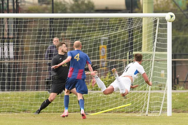 Binfield skipper Sean Moore heads against the post. Picture: Keith Woodland