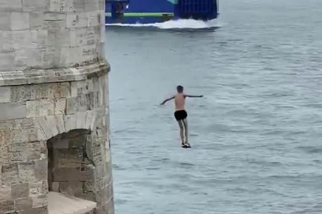 A youth is seen leaping from Old Portsmouth's Hot Walls. Photo: Twitter/Proud of Portsmouth