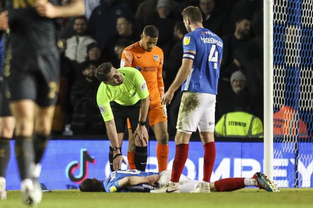 Shaun Williams had to leave Fratton Park in a wheelchair following a second-half collision which left him floored. Picture: Robin Jones