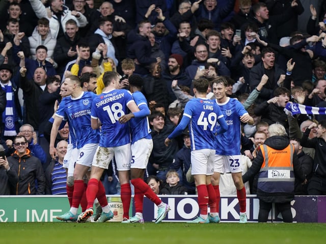 The Pompey players celebrate Paddy Lane's first-half opener in front of the Milton End