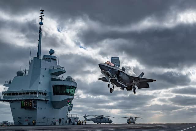 The view of HMS Queen Elizabeth's flight deck during operational testing with the UKs F-35B Lightning jets. This image was part of the Peregrine Trophy winning selection from HMS Queen Elizabeth. The image also won the Best in Show Prize. Picture by Leading Photographer Kyle Heller