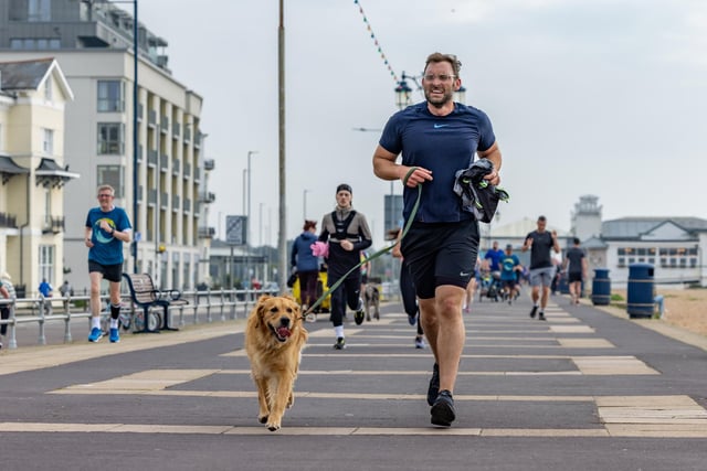 A competitor running with his dog in the Southsea parkrun. Picture: Mike Cooter