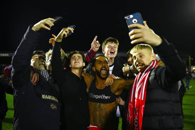 Selfie crazy - Ashley Hemmings of Kidderminster Harriers celebrates with fans following his side's win against Reading. Photo by Clive Mason/Getty Images.