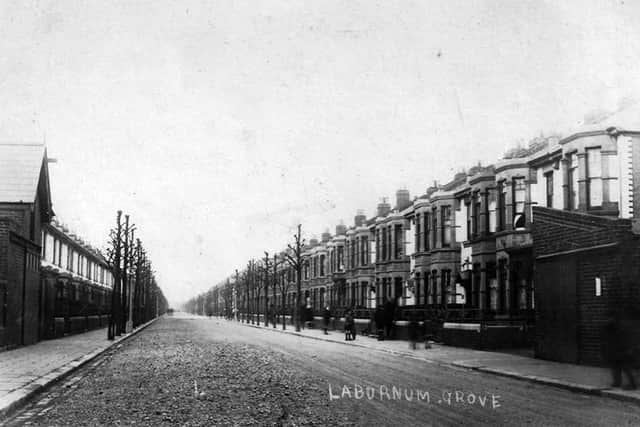 Laburnum Grove, North End, Portsmouth. Laburnum Grove (AKA Lavatory Lane or Brass Button Alley) - Many of the houses in Laburnum Grove are faced with a white glazed brick. These were left over from the building of The Blackwall Tunnel in 1896 and bought by local builder Peter Briggs for a farthing each.