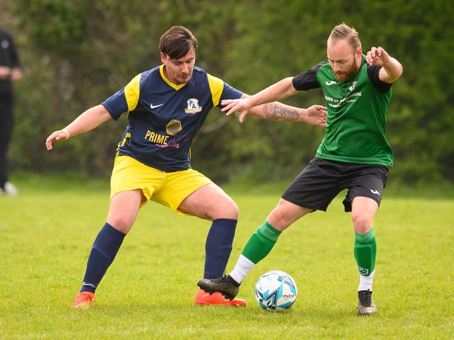 Action from Saturn Royale's 1-0 win over Pelham Arms (blue and yellow kit) in the second Adelaide Cup semi-final. Picture: Keith Woodland (300421-125)