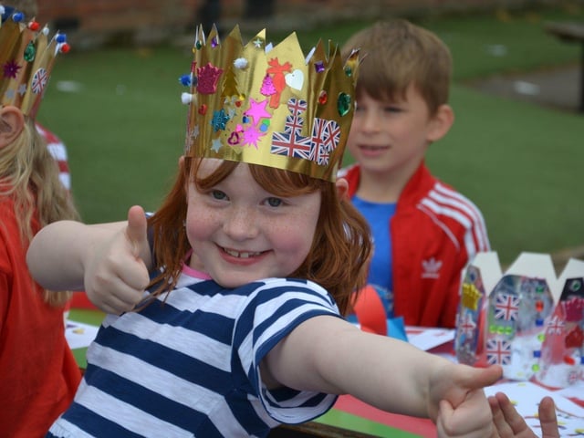 Pupils enjoying a Platinum Jubilee street party in the playground of Devonshire Infant School, Southsea