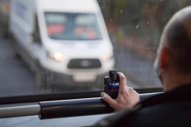 Police officers is enforcing the new laws which closes loopholes allowing motorists to use mobile phones while driving. Photo by Finnbarr Webster/Getty Images.