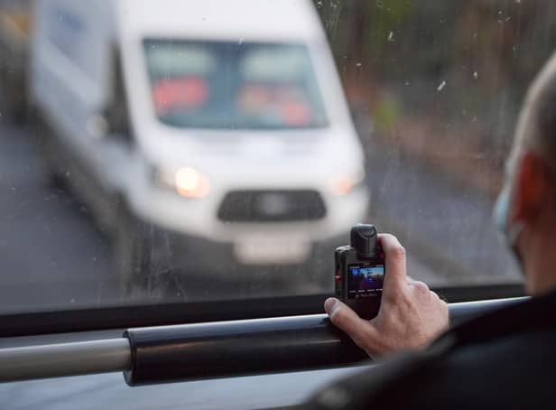 Police officers is enforcing the new laws which closes loopholes allowing motorists to use mobile phones while driving. Photo by Finnbarr Webster/Getty Images.