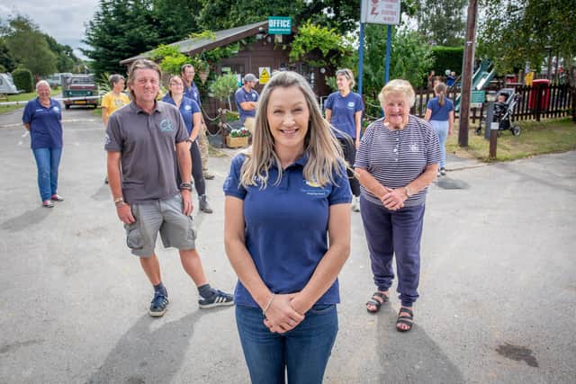 From left, director Jason Good, his wife, Eleanor Good and owner Sita Good with staff of The Oven Camp Site. Picture: Habibur Rahman.