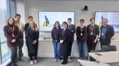 Portsmouth North MP Amanda Martin (front-right of the left hand group), Baker Dearing Chief Executive Kate Ambrosi (centre), UTC Portsmouth principal James Doherty (furthest right) and students.