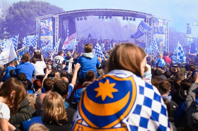 Pictured is: Pompey Supporters celebrate with the players on the stage
Picture: Keith Woodland (280421-499)