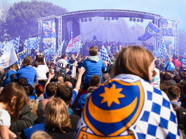 Pictured is: Pompey Supporters  celebrate with the players on the stage

Picture: Keith Woodland (280421-499)