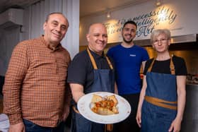 Staff at El Greco, Kristo Serani, Nikolaos Zarkadas, Entela Serani and Vaggelis Banos with their signature dish, Lamb Kleftiko. Picture: Habibur Rahman