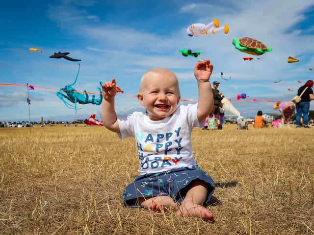 Walter Shute, 10 months, enjoying the kites.