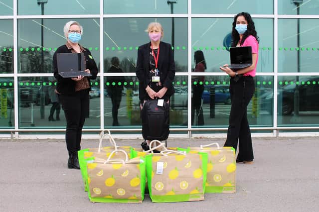 From left: Sara Osborne, Susan Parish, and Katy Trapani, holding the equipment being donated by ASDA Havant to Park Community School. Picture: Emily Turner