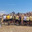 Hundreds of people dressed as bees walked from Havant Park to Hayling Island to raise money for a mother who has terminal bowel cancer.