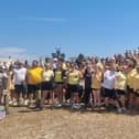 Hundreds of people dressed as bees walked from Havant Park to Hayling Island to raise money for a mother who has terminal bowel cancer.
