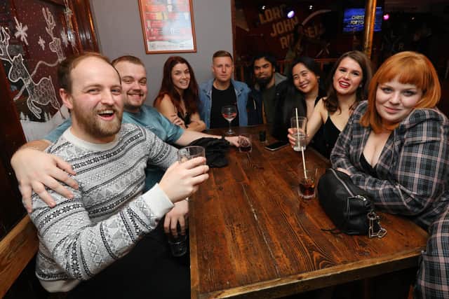 Drinkers at The Lord John Russell, including Hannah Jones, second right. Going out in Albert Road, Southsea, on the last weekend before Christmas
Picture: Chris Moorhouse (jpns 171221-41)